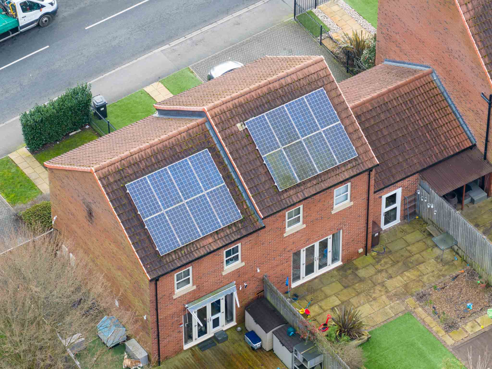 Aerial,Drone,View,Looking,Down,At,Modern,Brick,Suburban,Houses