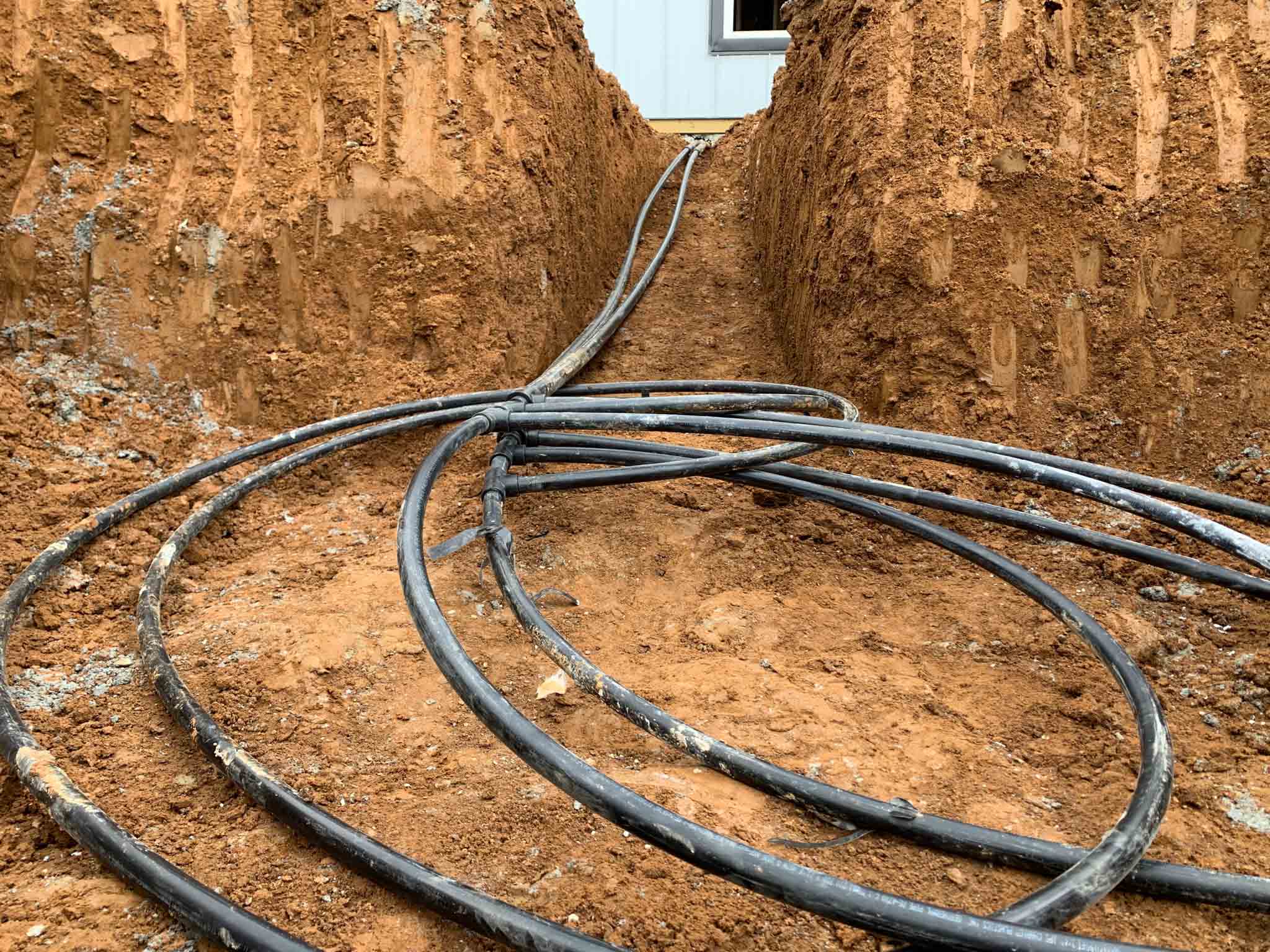 Geothermal ground source heat pump loop installation
