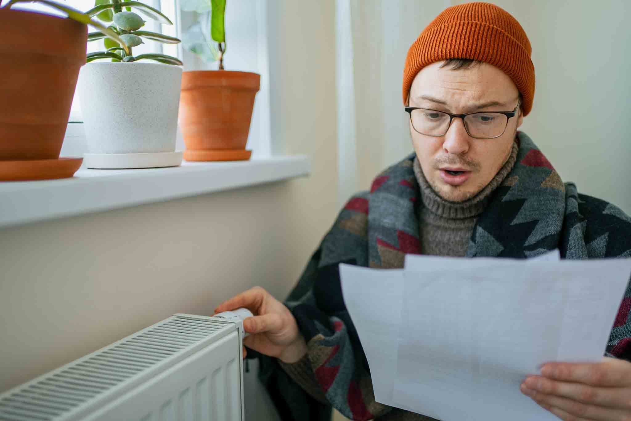 homeowner shocked checking his winter energy bill