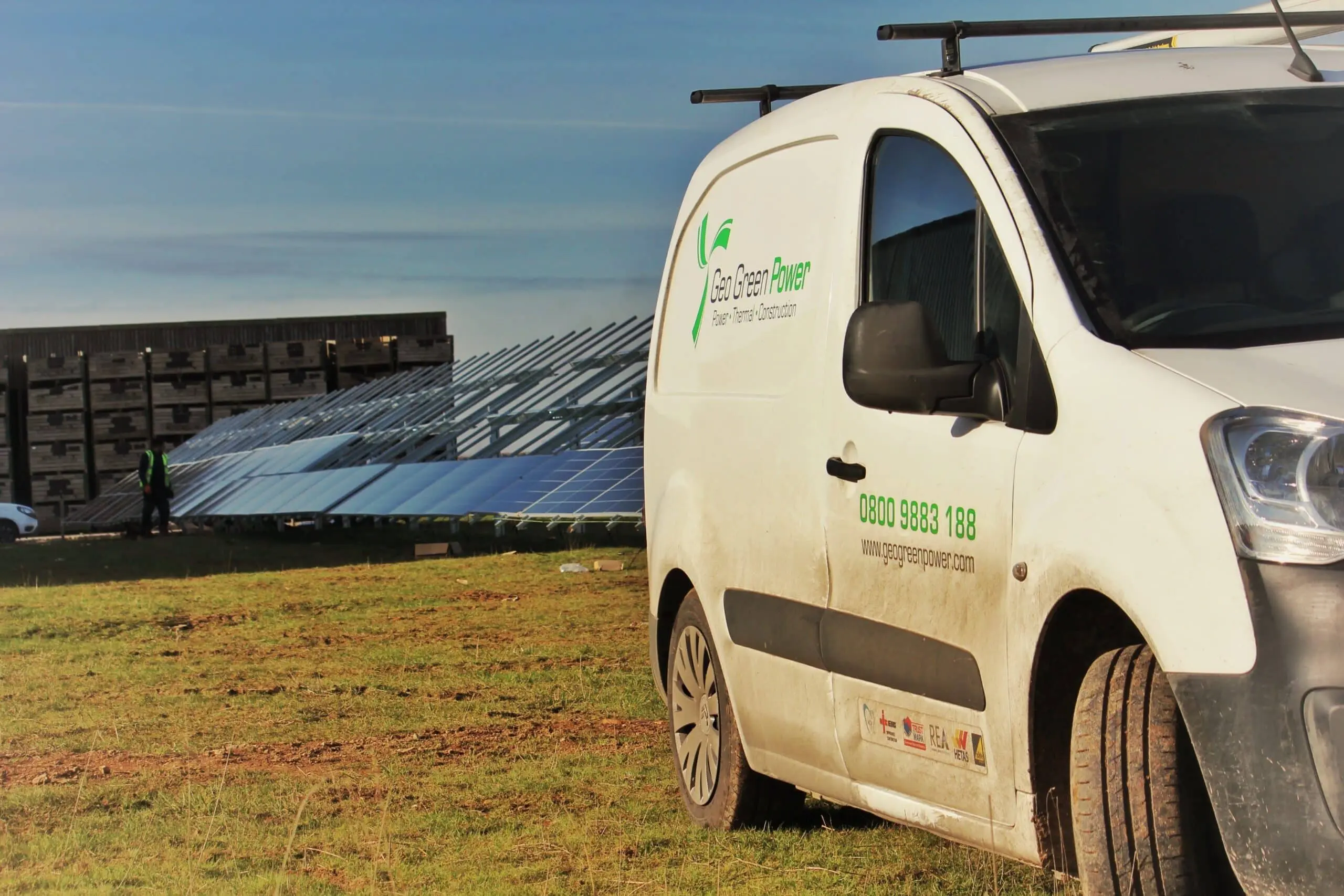 geo green power van on site in front of solar panel farm installation