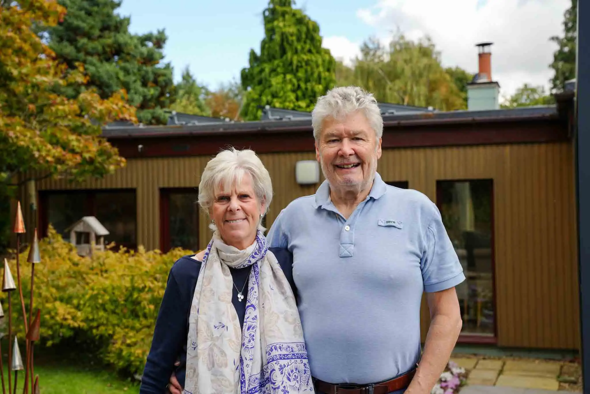 happy couple after solar installation for their home