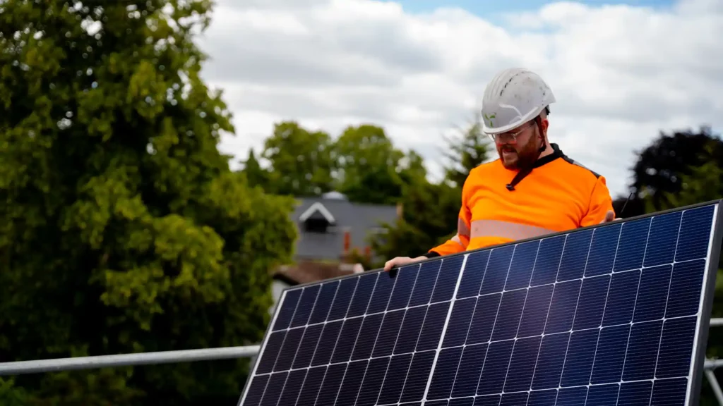 solar installer holding a panel