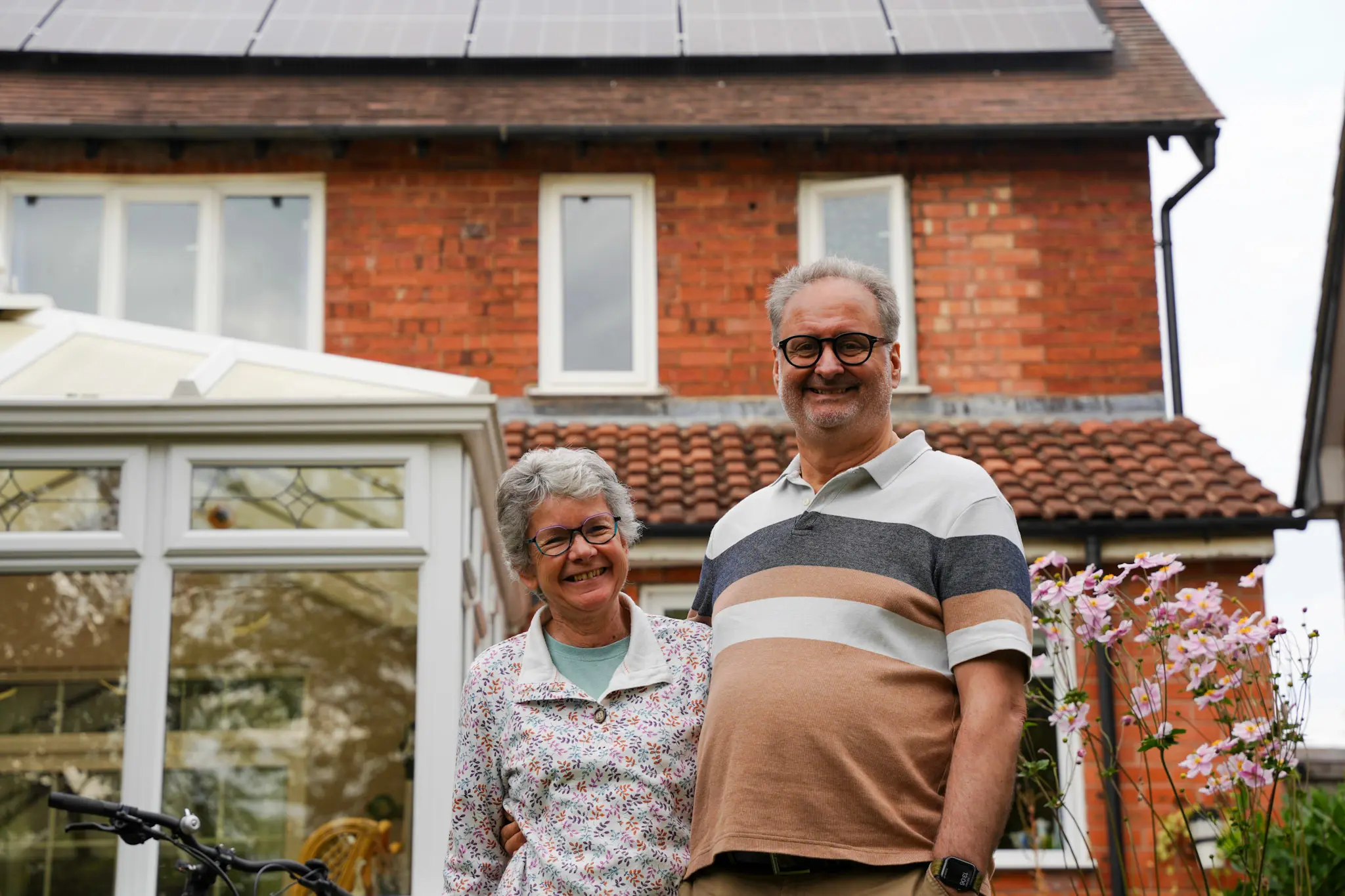 happy homeowners after their renewable energy installation