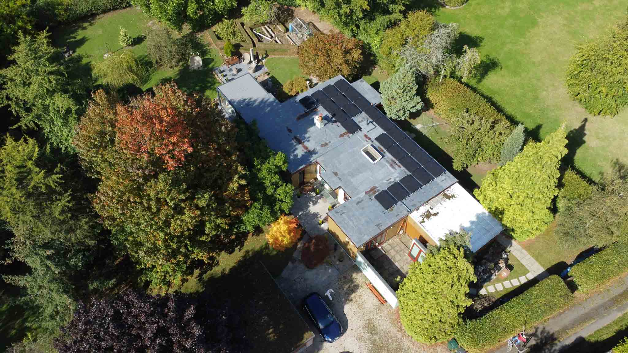 new build house with solar on flat roof