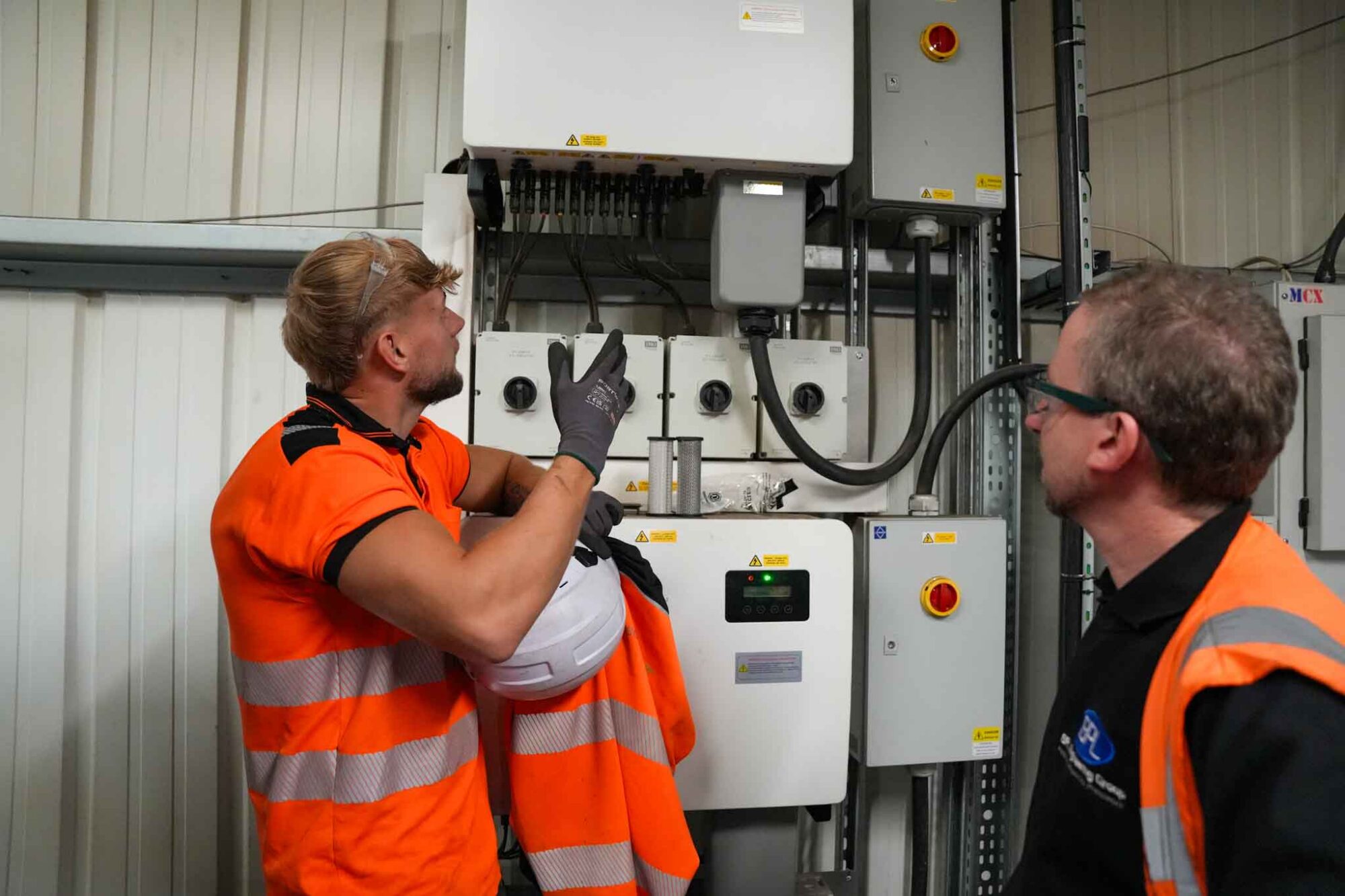geo green power's commercial solar maintenance check up with a client