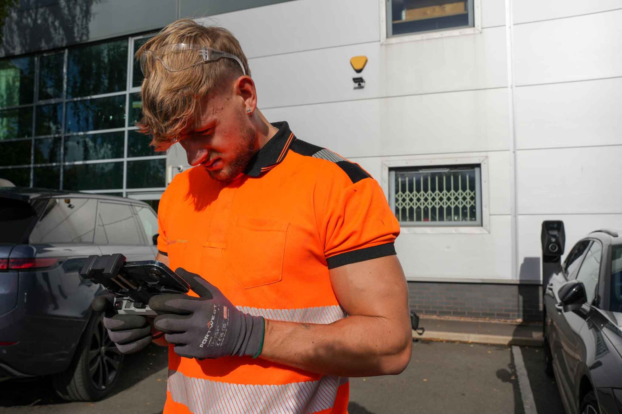geo green power employee giving client commercial solar annual service in the midlands